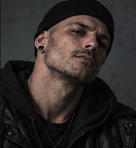 Pulse wearing a beanie, looking directly at the camera.
