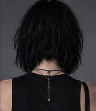 Vanta photographed from behind, showing her hair and the back of her neck.